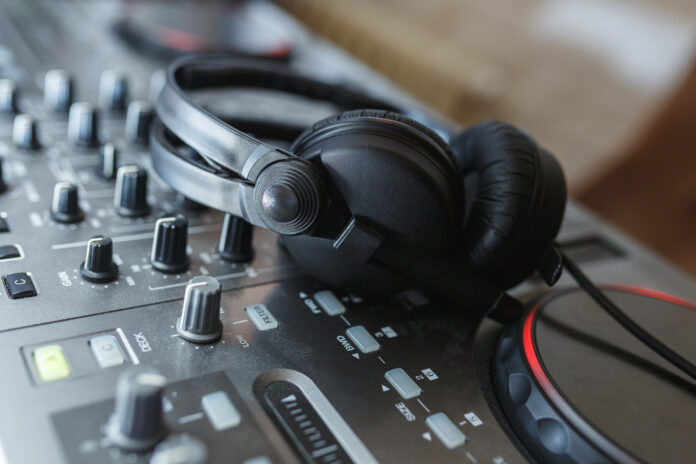 DJ Mixer with headphones. mixing in headphones